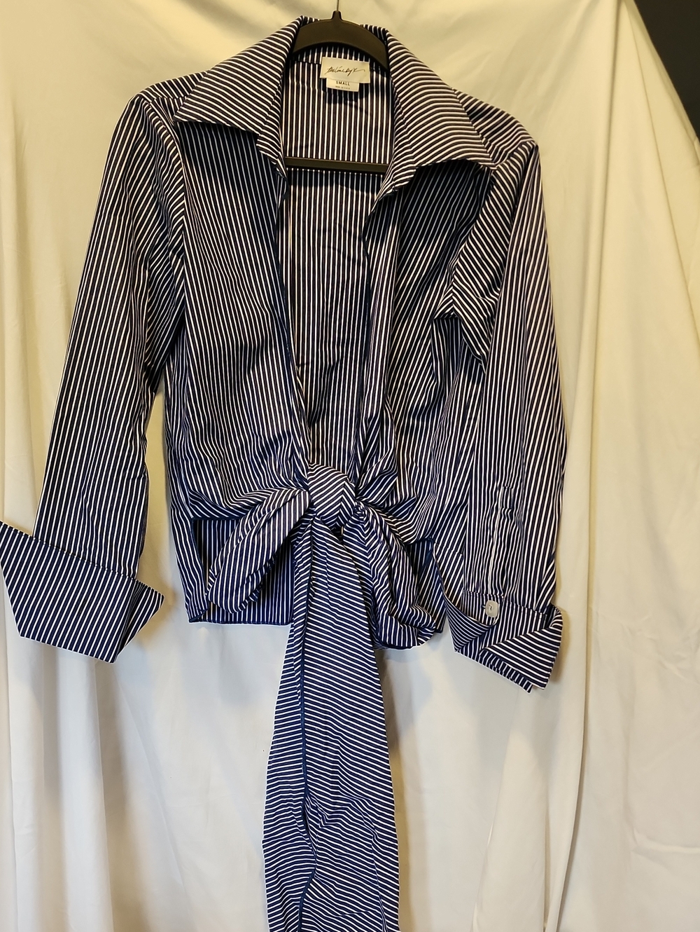 The line by k, blue and white striped tie front shirt with Cuffed long sleeves.